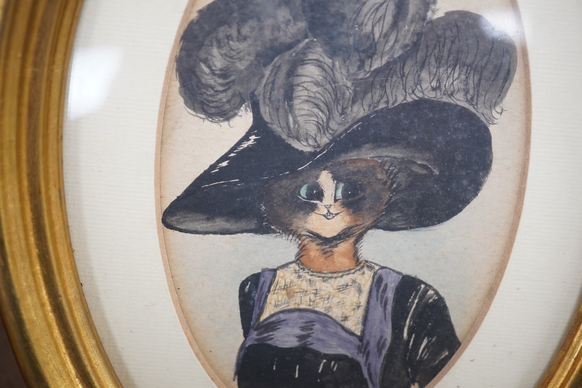 Style of Louis Wain (1860-1939), pair of oval watercolours, Comical studies of cats, 12 x 8.5cm, gilt framed. Condition - fair